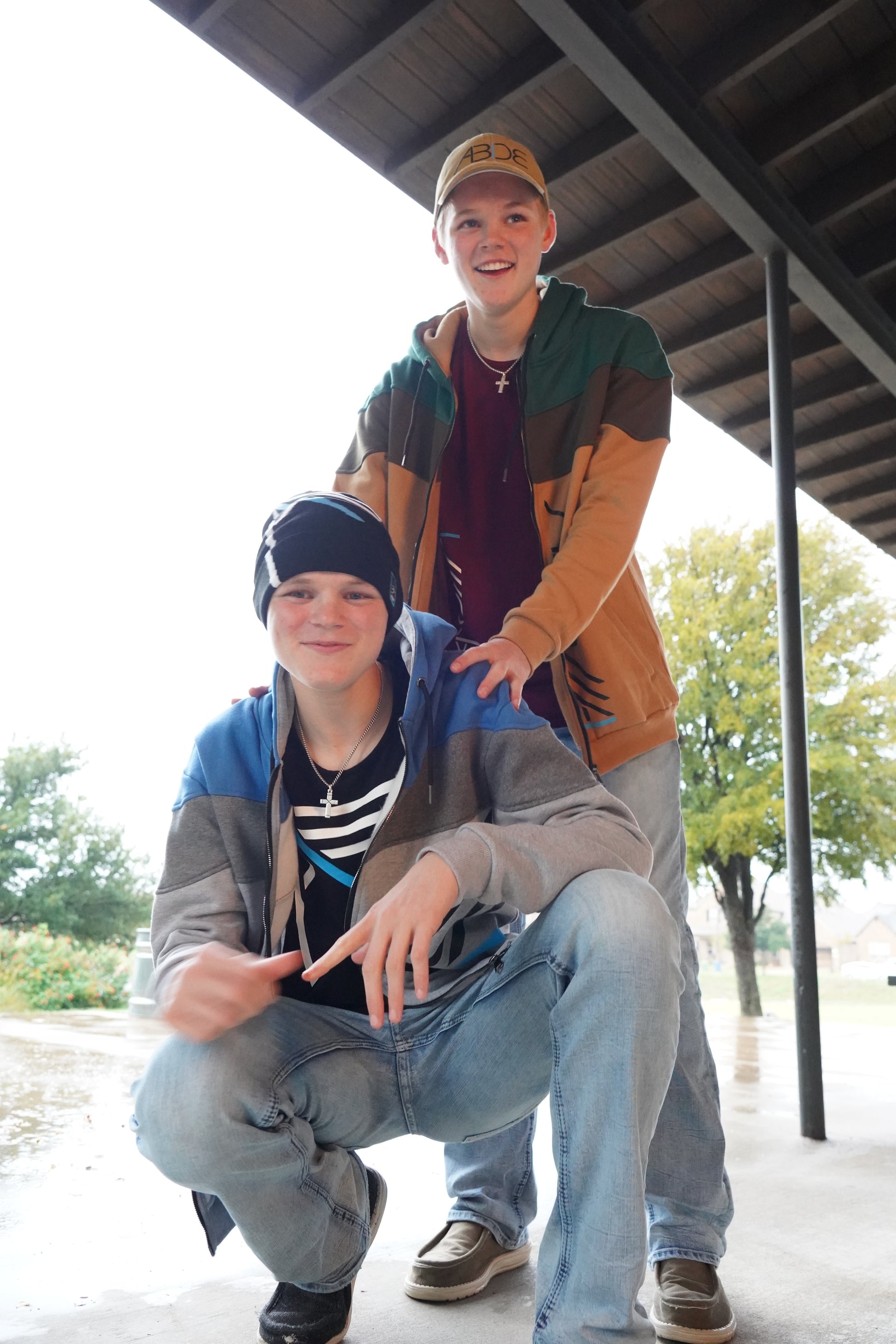 Christian Teen Boys hanging out wearing Christian Apparel including zip up hoodies, bamboo tees, I AM beanie, and ABIDE hats