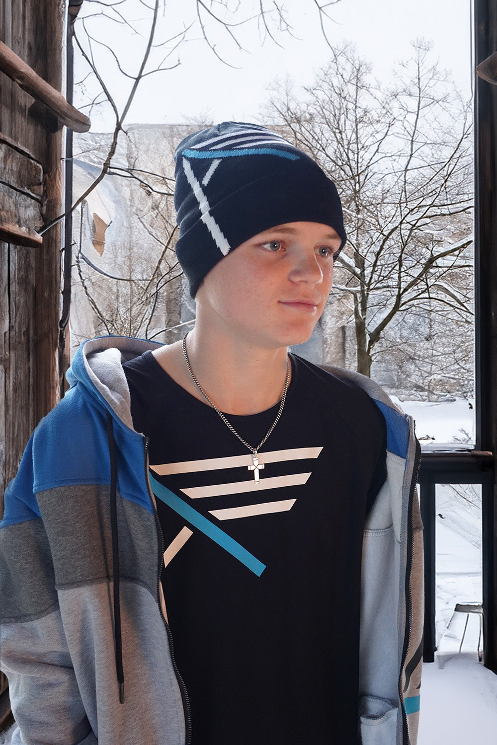 Young Christian Wearing I AM Hoodie, Beanie, and Bamboo tee from Now Found Christian Apparel