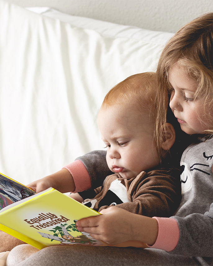 children reading "equally treasured" christian children's family storybook by shelby cohen, illustrated by steven cohen