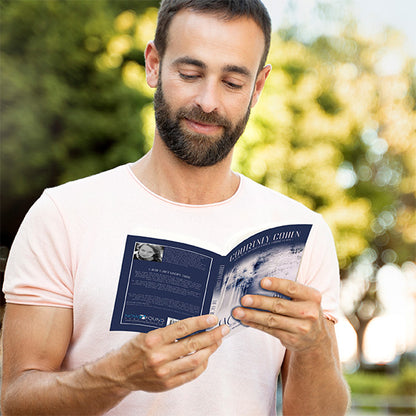 smiling latin christian man reading the sacred shadow in park