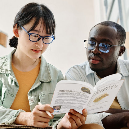 Young adult couple reading "Refining Identity" by courtney cohen together