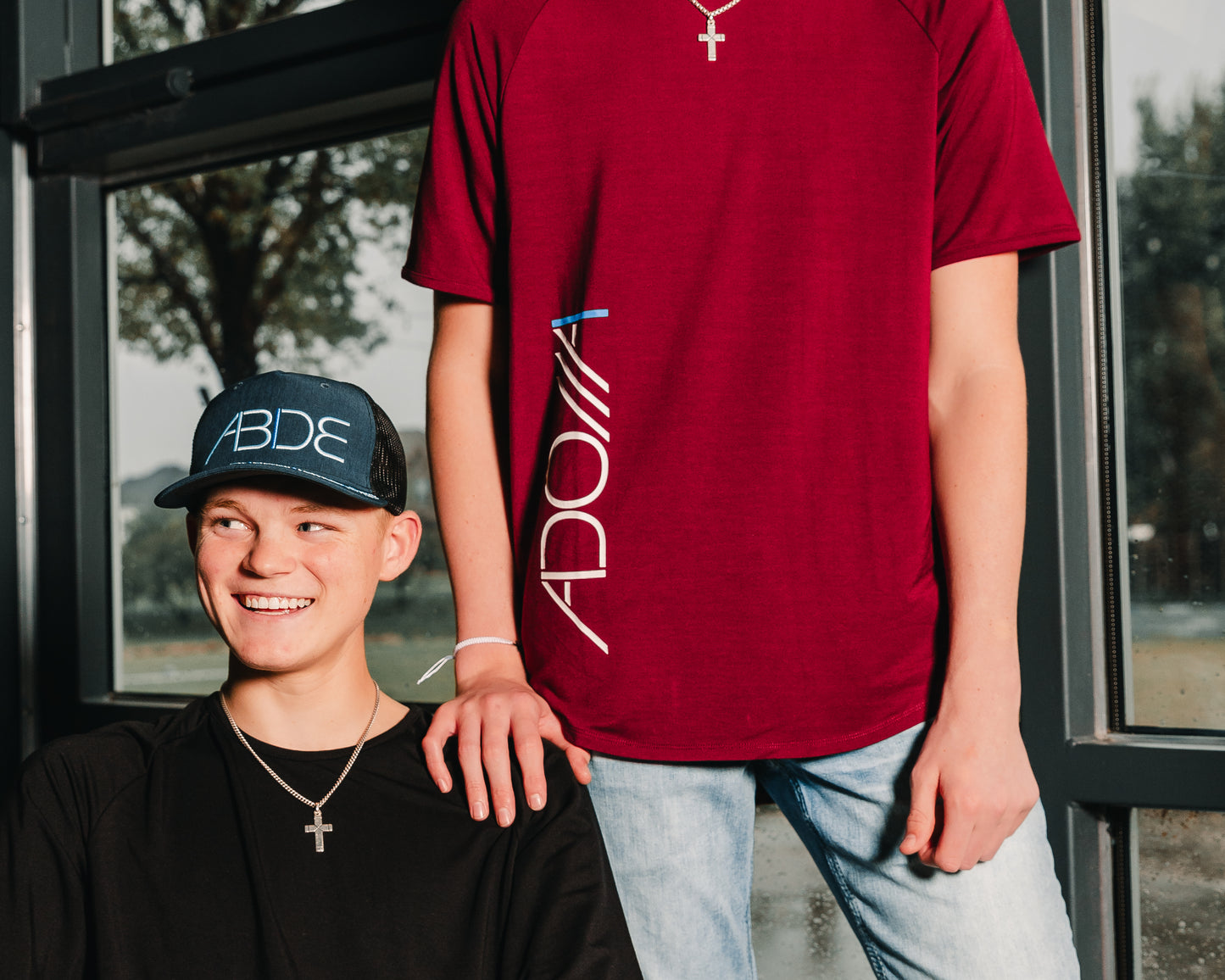 christian youth wearing now found apparel "adonai" bamboo tees midnight black and wine red and ocean blue "titanic" "abide" trucker hat